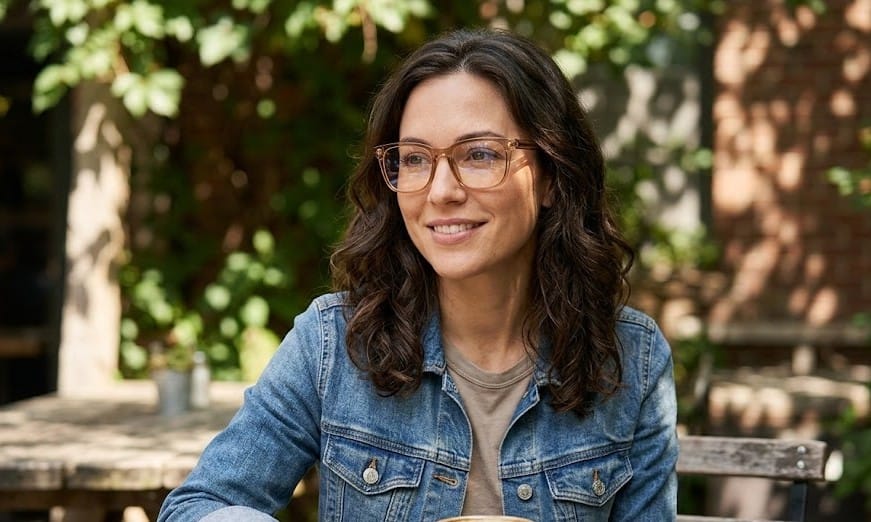 A girl wearing Soft Brown Transparent Glasses Frame